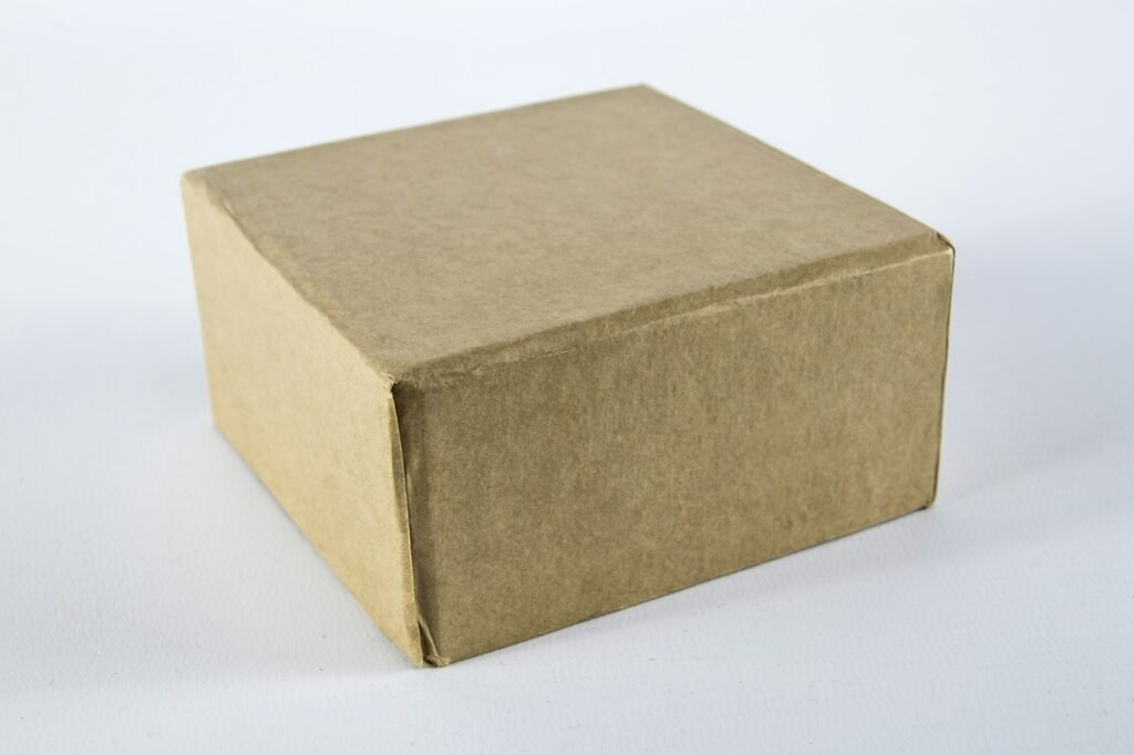 Brown cardboard box on a white surface