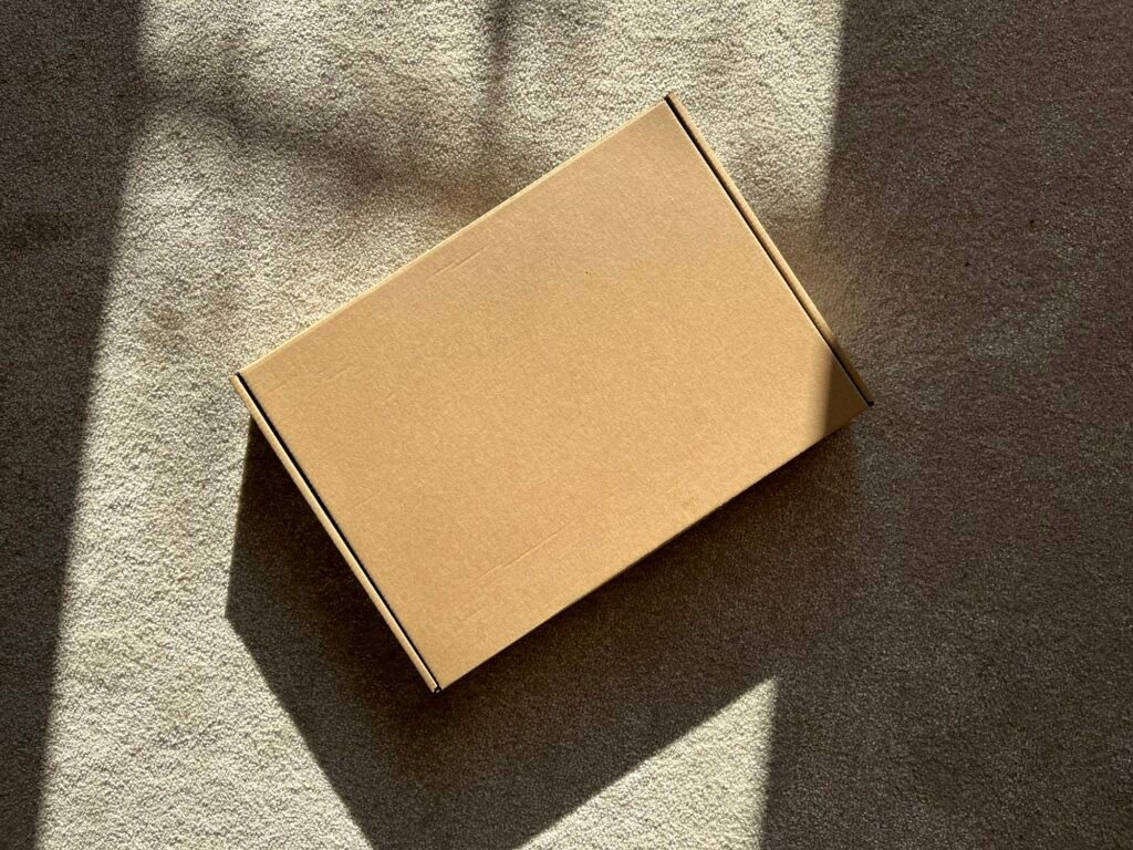 A cardboard box on a textured surface