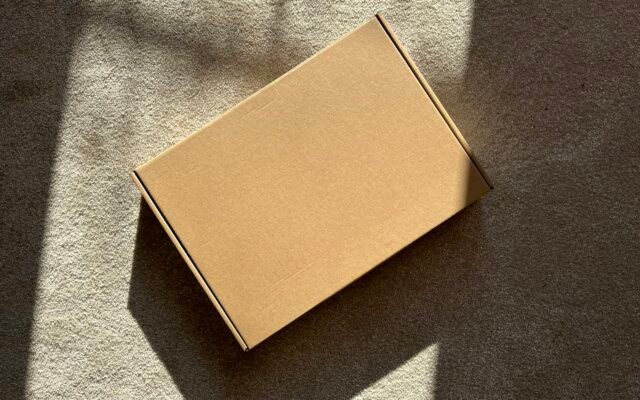 A cardboard box on a textured surface