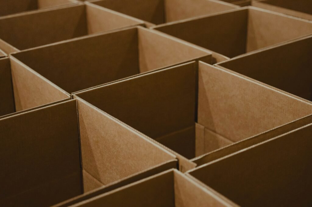 A stack of open brown cardboard boxes