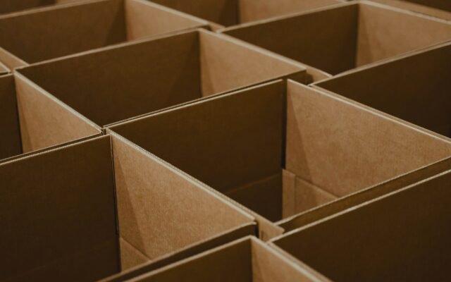 A stack of open brown cardboard boxes
